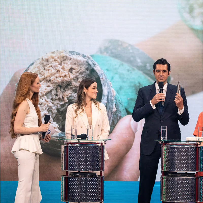 AQON PURE Gründer Maximilian Wilk spricht auf dem Austrian World Summit